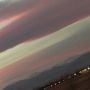 Handiwork of heaven eclipses the artistry of humanity. Amazing pink hue in sky over snowcapped Mts. 