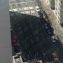 Look carefully at the shadow. Those bright spots are sunlight reflected off building windows onto street